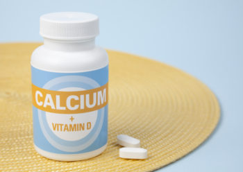 calcium bottle and 2 pills