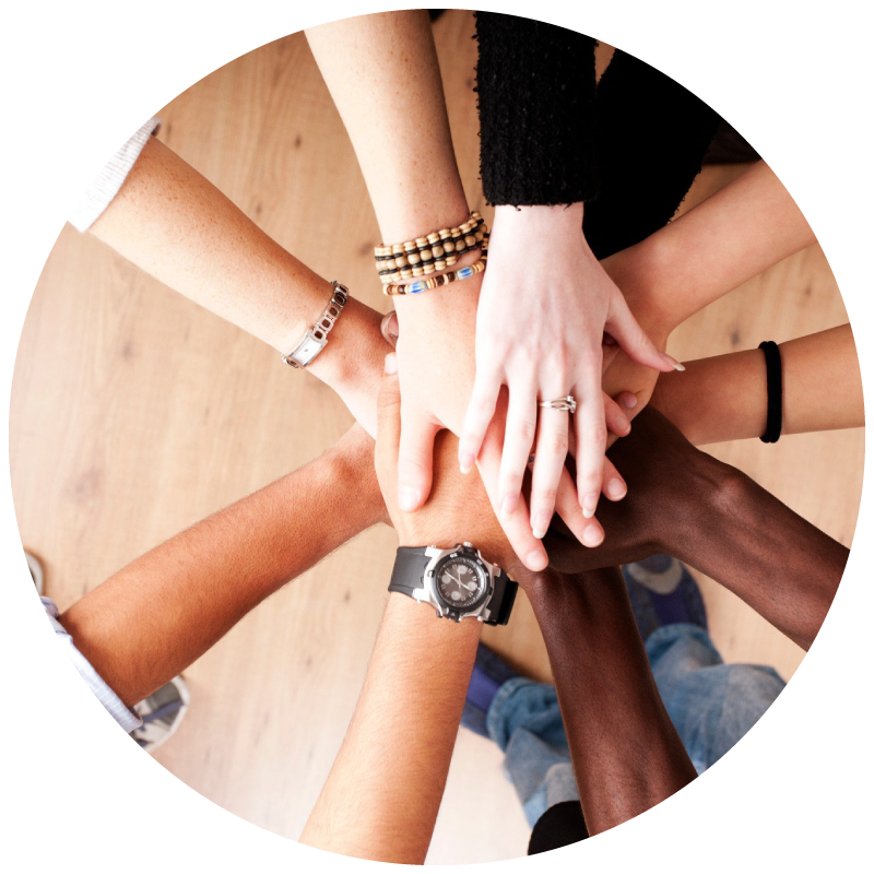 team hands in circle